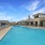 Community pool with tanning deck and fountains