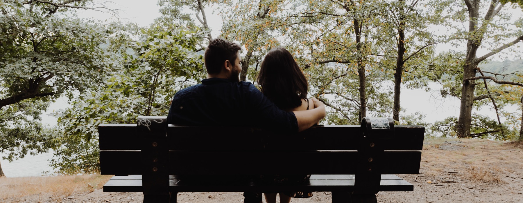 Couple relaxing on a park bench